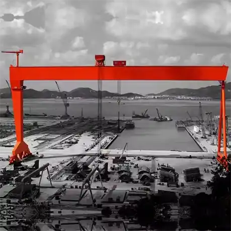 Industrial shipbuilding gantry crane positioned over ship construction site